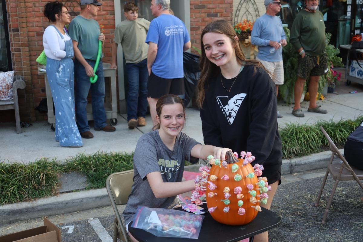 Families enjoying fall fest evening
